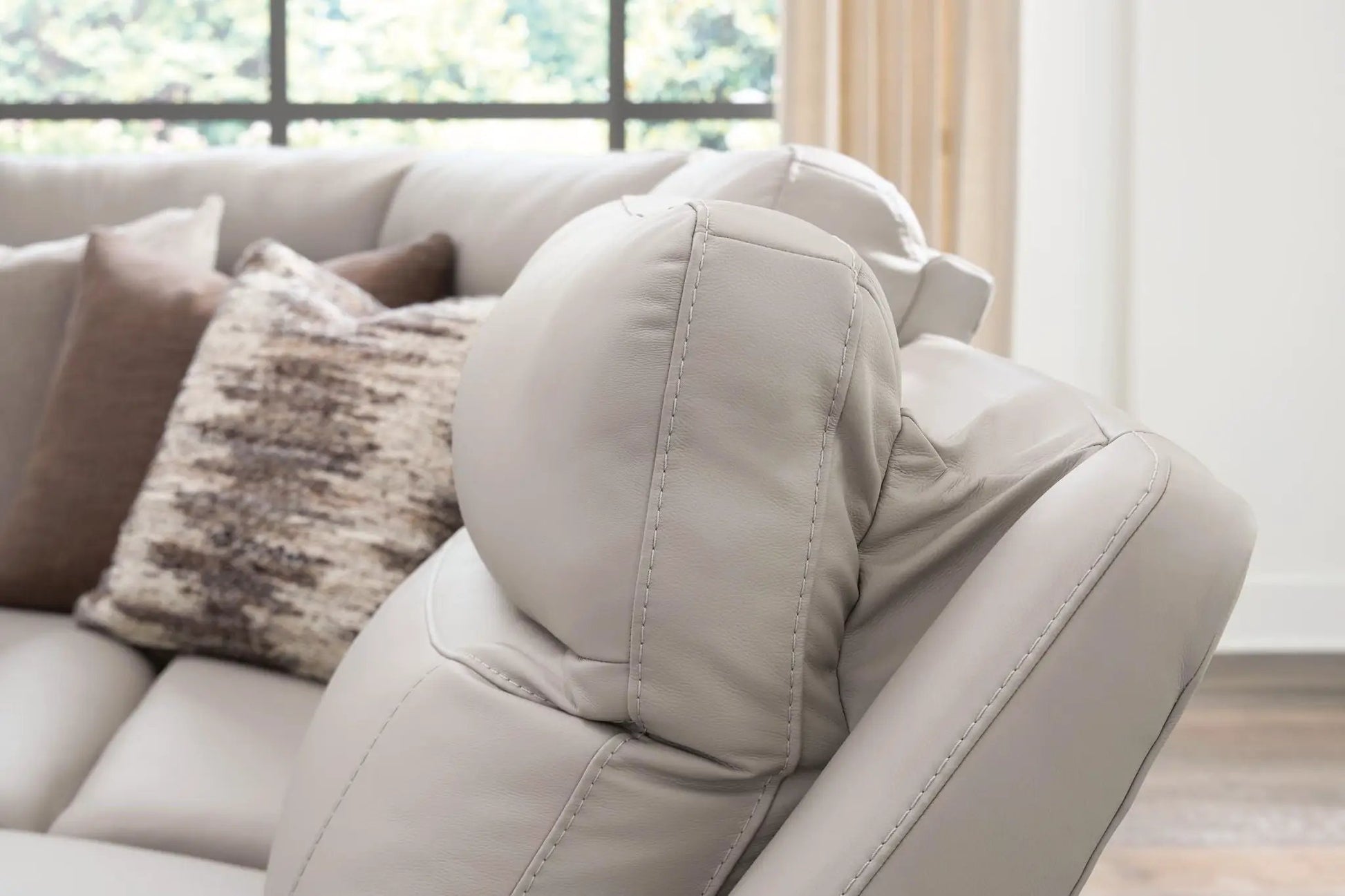 Gravier reclining sectional gray leather with visible stitching on Tampa Home & Garden Store