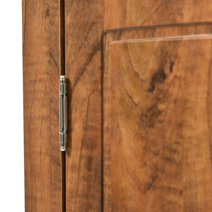 Triangle bathroom storage cabinet door close-up with metal hinge on warm wood grain on Tampa Home & Garden Store