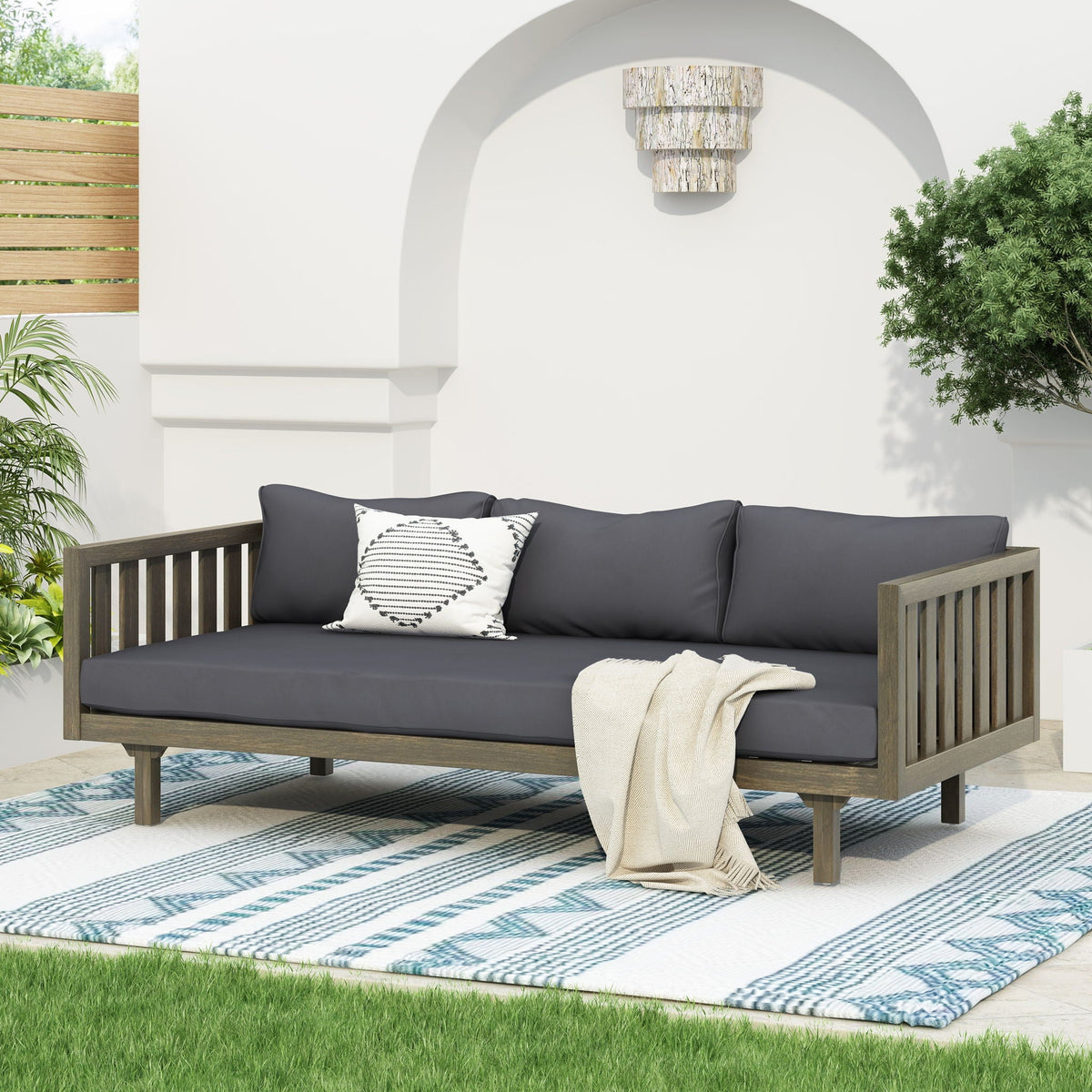 Claremont 3 Seater Daybed with teak acacia wood frame and dark gray water-resistant cushions on Tampa Home & Garden Store