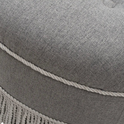 Yolanda round upholstered accent ottoman in gray fabric with white rope trim and fringe on Tampa Home & Garden Store