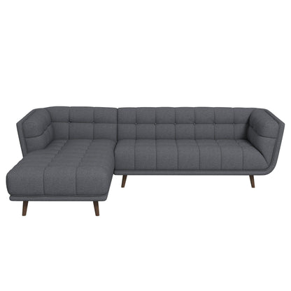 L-shaped sectional sofa tufted in dark gray fabric with mid-century modern legs on Tampa Home & Garden Store