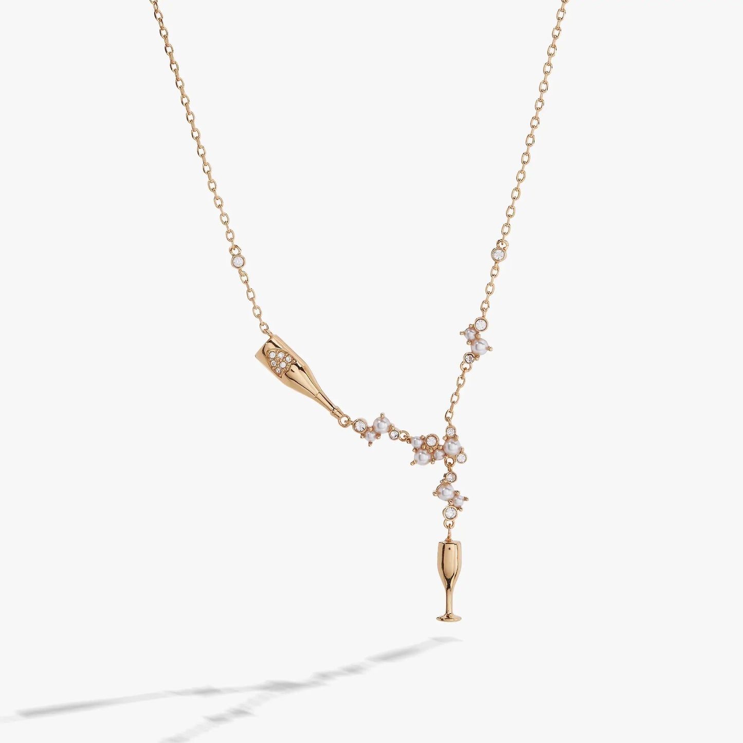 Champagne gold necklace with crystal cone pendant and pearl cluster accents on Tampa Home & Garden Store