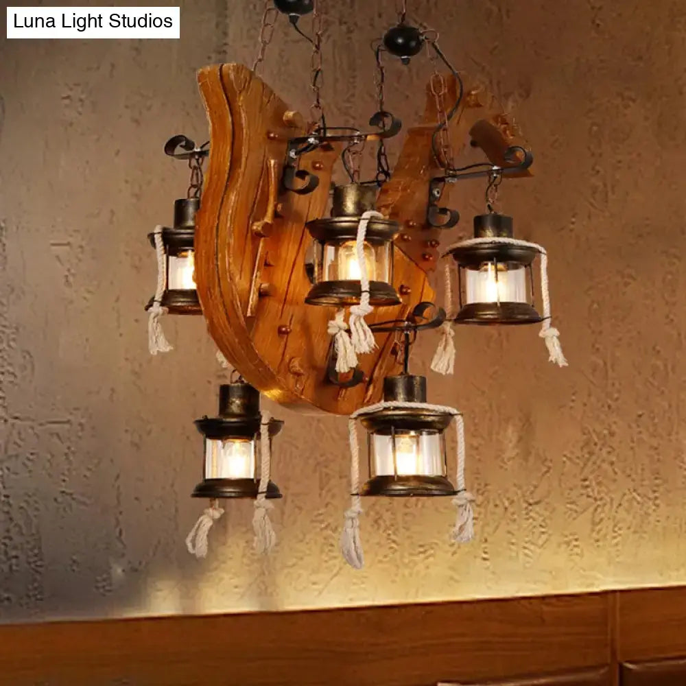 Wood Horse Chandelier Light with rustic backplate and lanterns with tassels, warm glow on Tampa Home & Garden Store