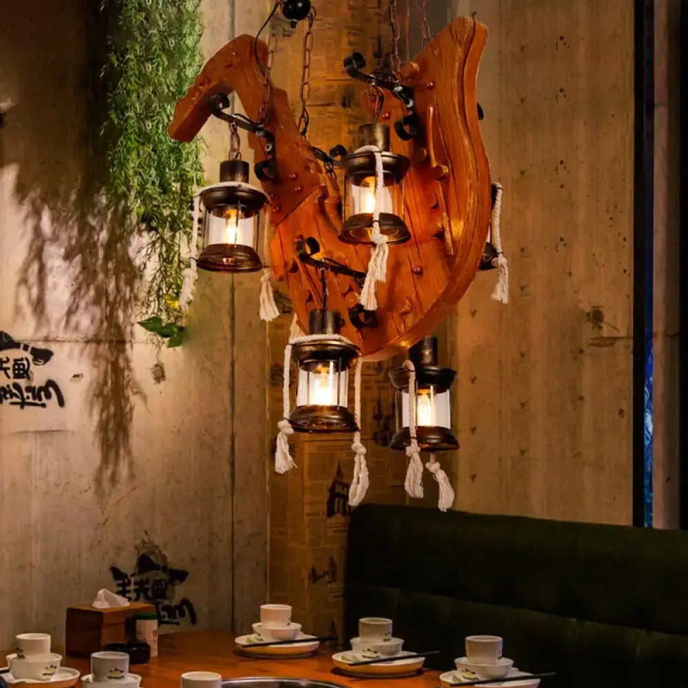 Wood Horse Chandelier Light with rustic curved wood base and hanging lanterns with rope tassels on Tampa Home & Garden Store