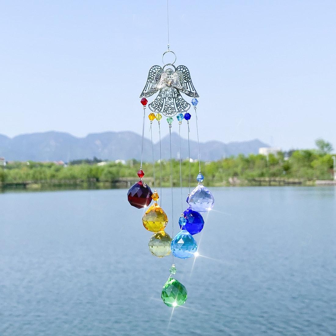 Stevvex rainbow crystal wind chime suncatcher with angel filigree and hanging prism beads on Tampa Home & Garden Store