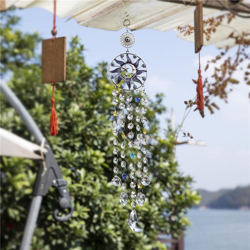 Chandelier wind chimes with Turkish blue evil eye sun moon charm, crystal prism strands on Tampa Home & Garden Store