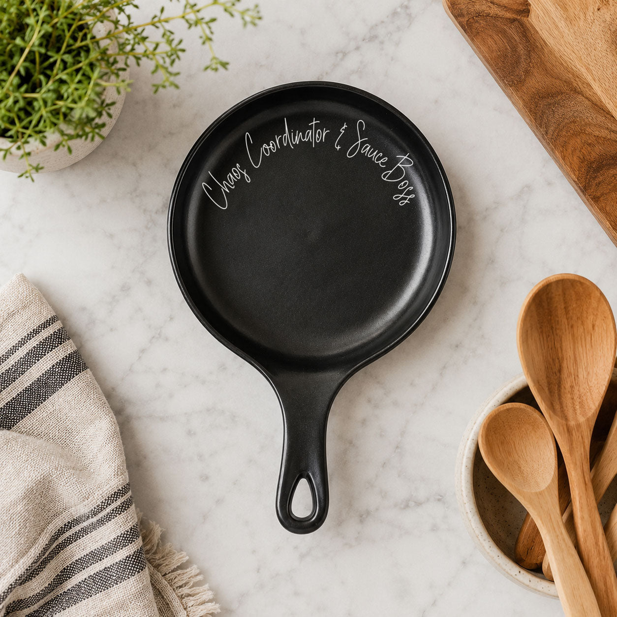 Chaos & Sauce Boss spoon rest by Gia Roma, black skillet-style kitchen accessory on Tampa Home & Garden Store