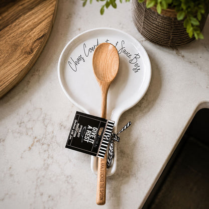 Spoon rest Chaos & Sauce Boss by Gia Roma on white ceramic plate with wooden spoon on Tampa Home & Garden Store