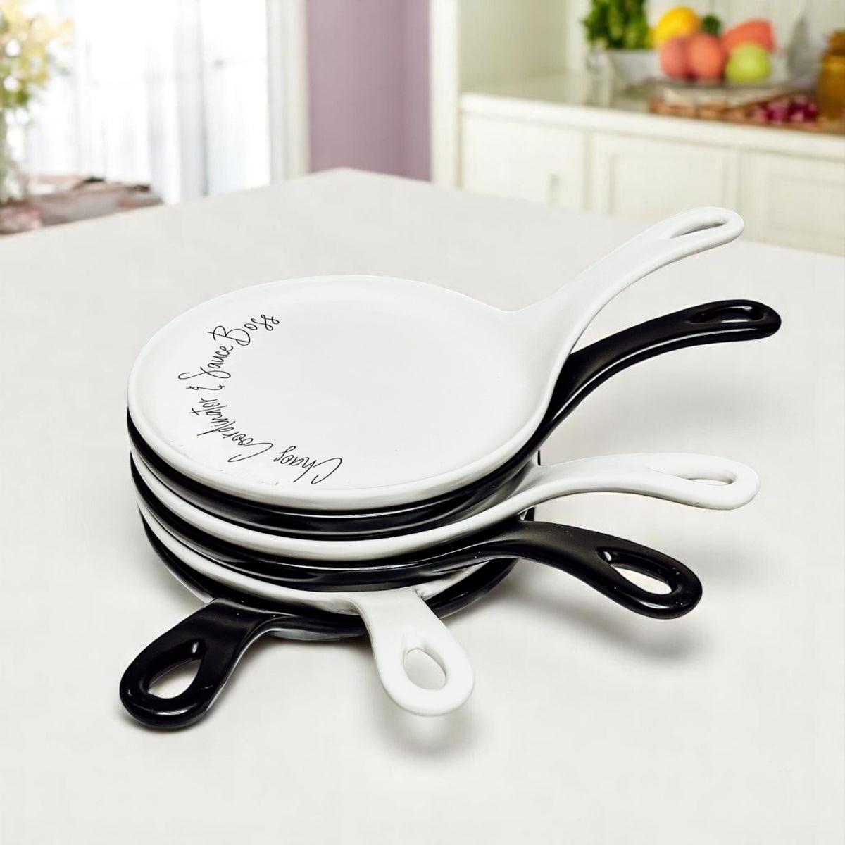 Chaos & Sauce Boss spoon rests Gia Roma white ceramic 4-pack with black accents stacked on top on Tampa Home & Garden Store