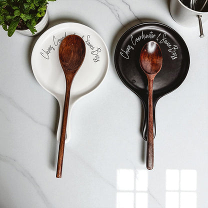 Chaos & Sauce Boss spoon rests by Gia Roma, pair of white and black ceramic with wooden spoons on Tampa Home & Garden Store