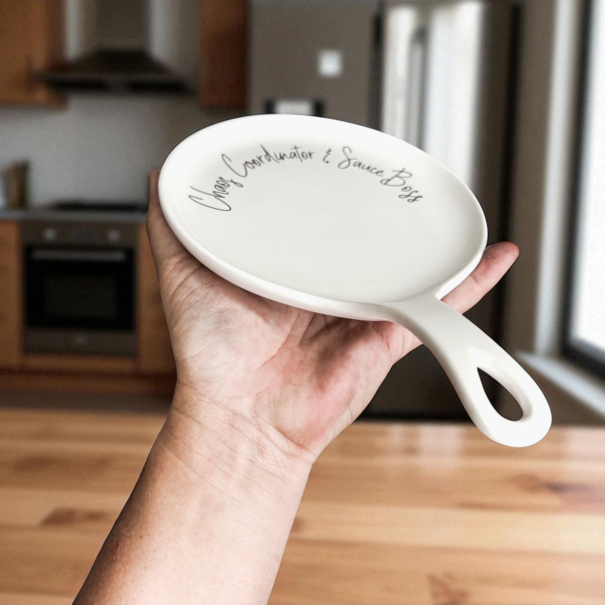 Chaos & Sauce Boss spoon rest by Gia Roma, white ceramic kitchen accessory on Tampa Home & Garden Store