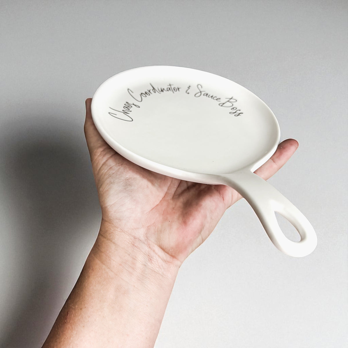 Chaos & Sauce Boss white ceramic spoon rest with integrated handle by Gia Roma on Tampa Home & Garden Store