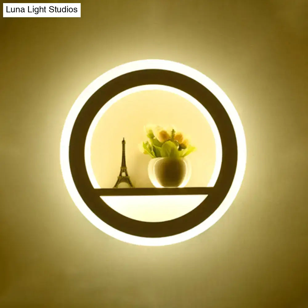 White Sun Wall Sconce with circular LED ring and shelf with a small Eiffel Tower and flowers on Tampa Home & Garden Store
