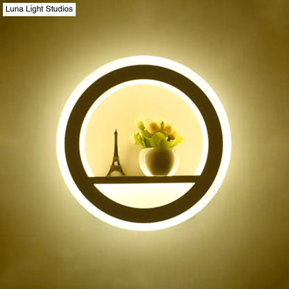 White Sun Wall Sconce with circular LED ring and shelf with a small Eiffel Tower and flowers on Tampa Home & Garden Store