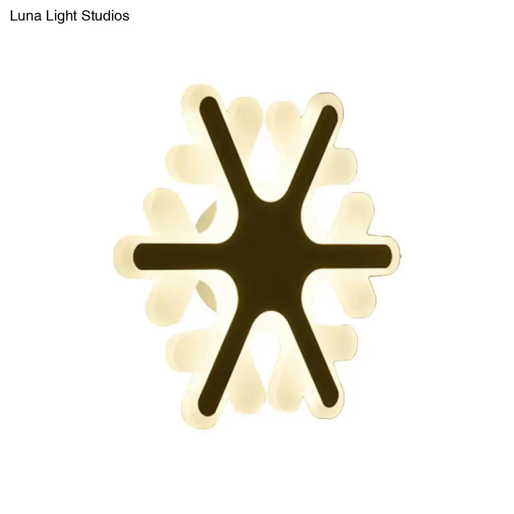 White sunburst wall sconce by Decorbites with dark central star arms and pale petal rays on Tampa Home & Garden Store