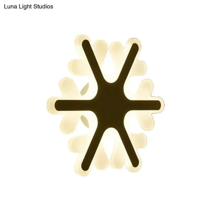 White sunburst wall sconce by Decorbites with dark central star arms and pale petal rays on Tampa Home & Garden Store