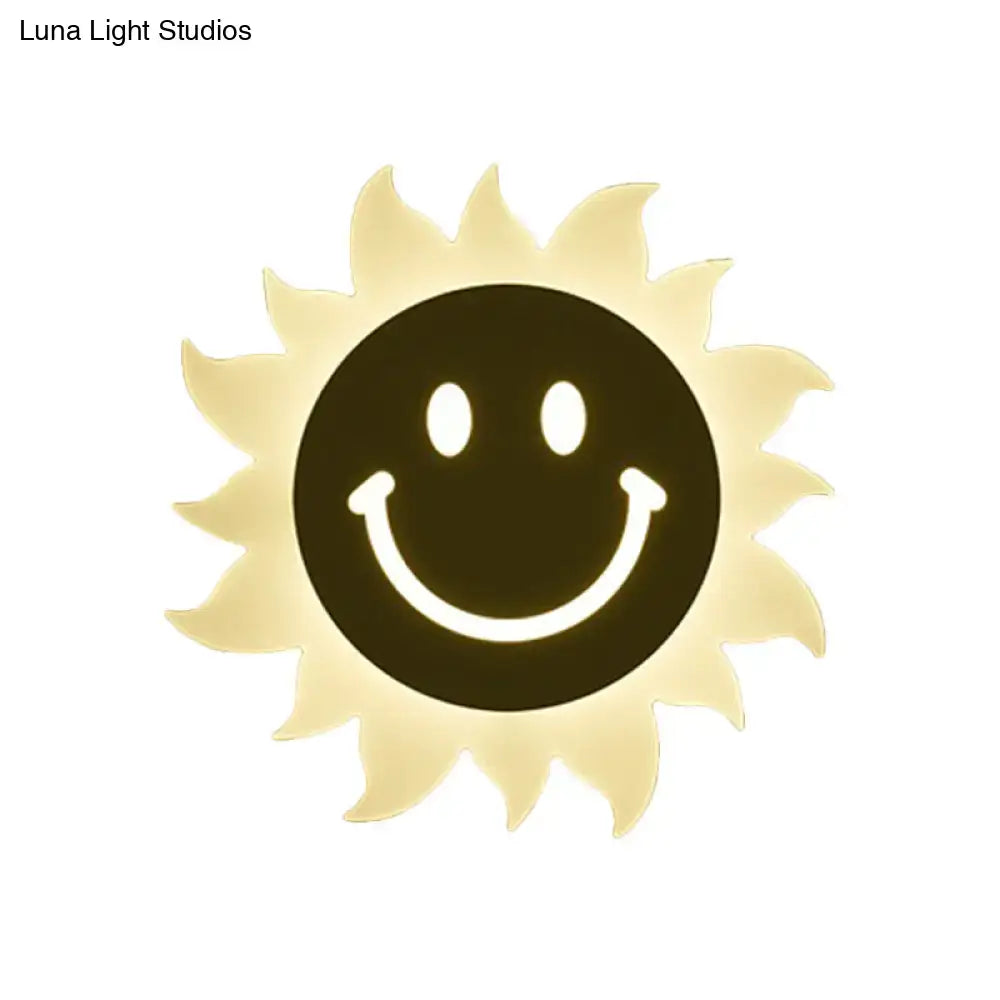 White Sun Wall Sconce with pale yellow rays and a black smiling center, Decorbites on Tampa Home & Garden Store