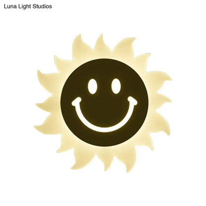 White Sun Wall Sconce with pale yellow rays and a black smiling center, Decorbites on Tampa Home & Garden Store