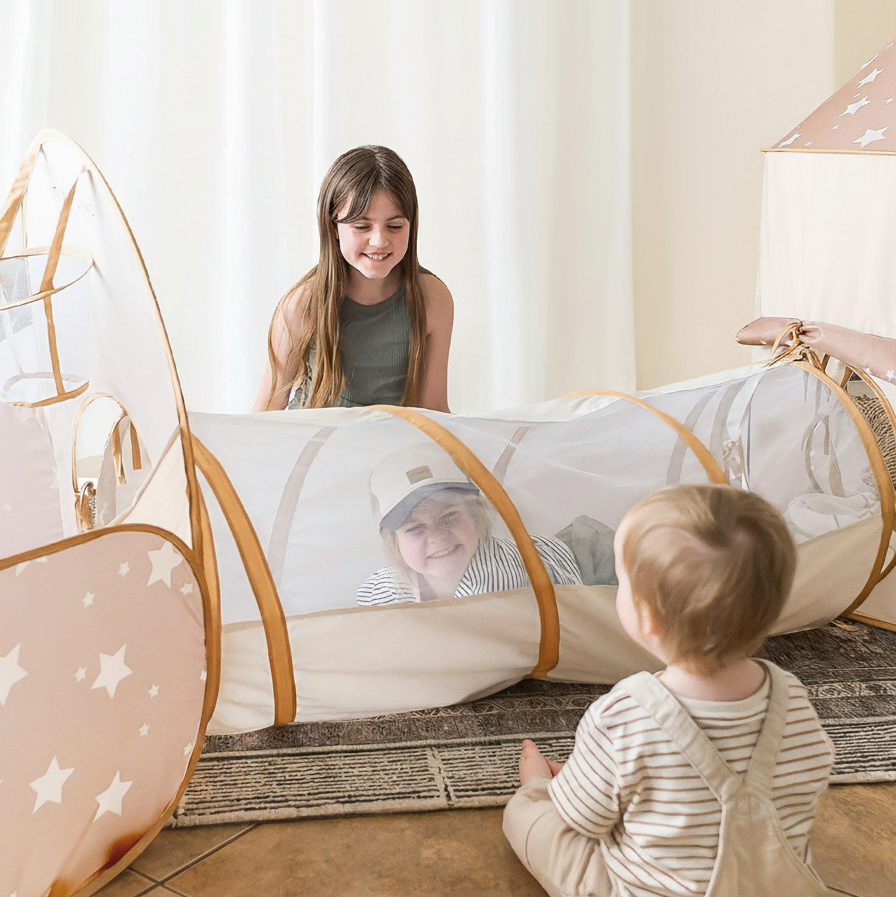 Tiny Land Discovery Play Tunnel with no balls, pink star panels, brown arches, kids inside on Tampa Home & Garden Store