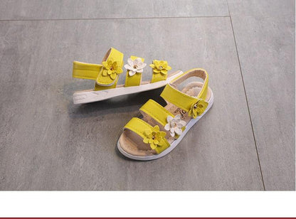 Pair of yellow Stevvex girls' sandals with flower embellishments, open-toe summer style on Tampa Home & Garden Store