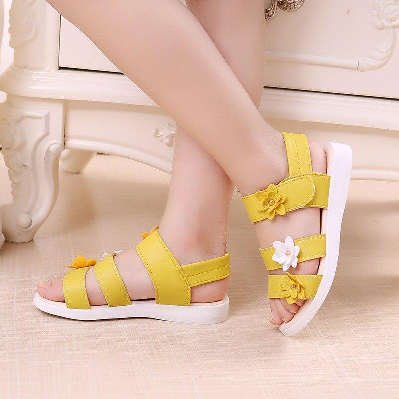 Girls' yellow strappy sandals with flower accents by Stevvex open-toe sandals for kids on Tampa Home & Garden Store