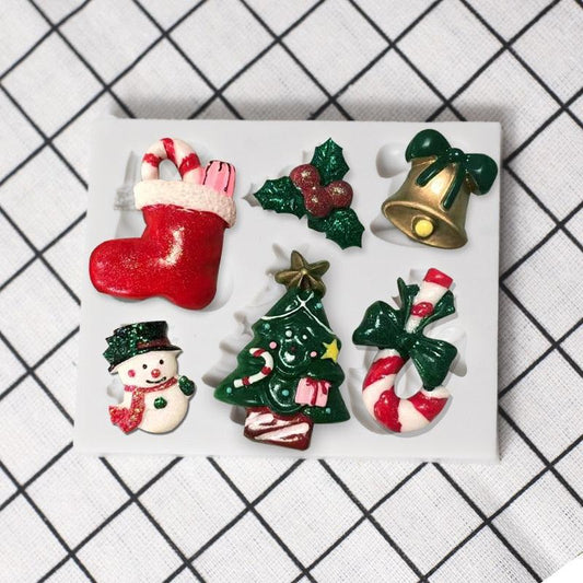 7-piece Christmas silicone mold set with Santa, tree, snowman and bell for fondant decor on Tampa Home & Garden Store