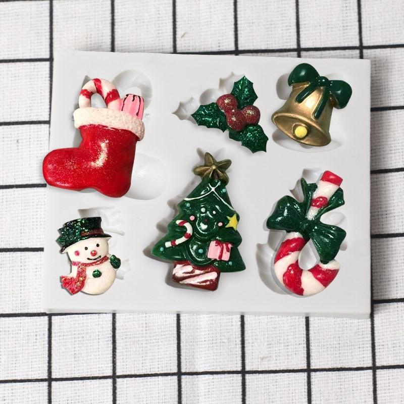 Stevvex Christmas silicone mold set with 6 festive shapes: stocking, holly, bell, snowman, Christmas tree, candy cane bow on Tampa Home & Garden Store