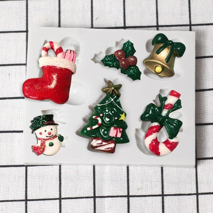 Stevvex Christmas silicone mold set with 6 festive shapes: stocking, holly, bell, snowman, Christmas tree, candy cane bow on Tampa Home & Garden Store