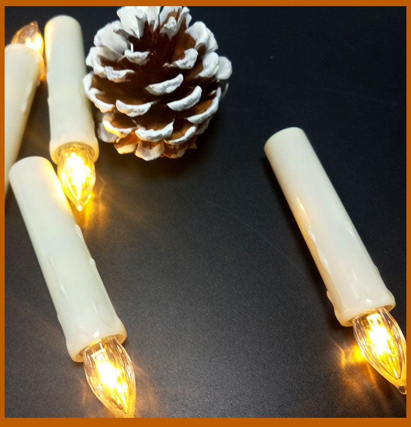 Flameless taper candles Stevvex in ivory, warm white LED bulbs, battery operated on Tampa Home & Garden Store