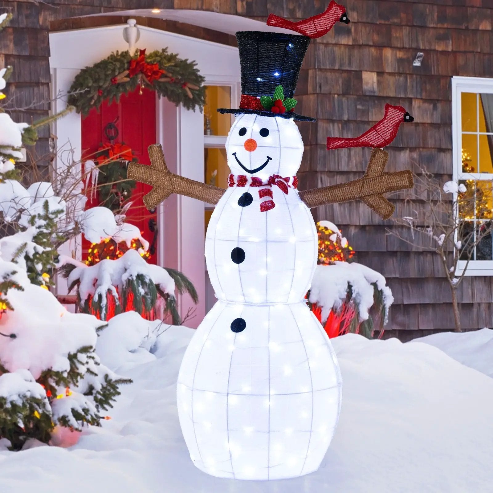 Lighted snowman yard decor with hat, scarf, and red cardinals in a snowy front yard on Tampa Home & Garden Store