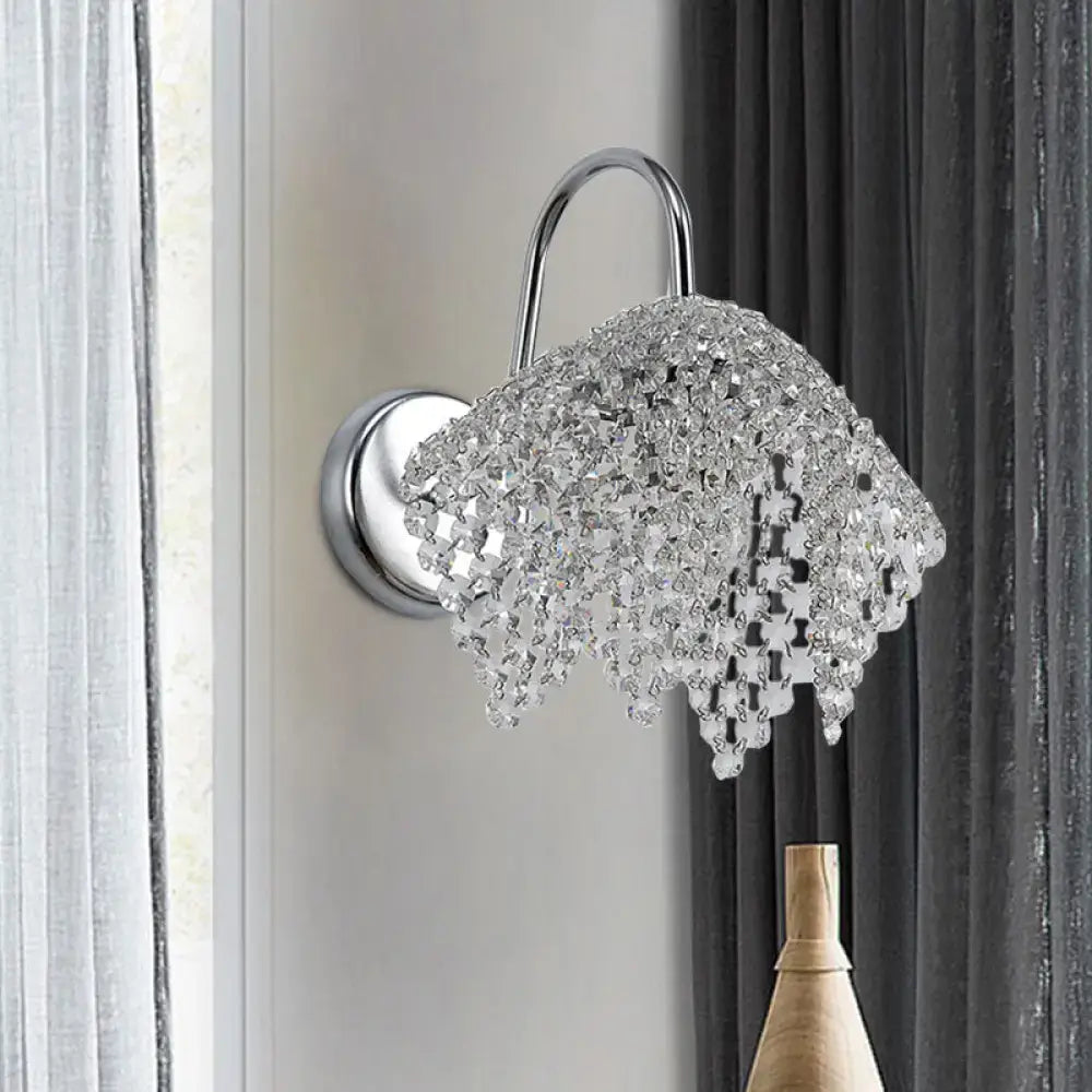 Chrome Crystal Bedroom Glow Wall Sconce by Decorbites with curved arm and hanging prisms on Tampa Home & Garden Store