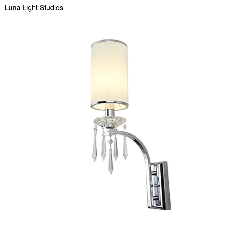 Chrome crystal space-saving wall sconce with a cylindrical beige shade and hanging prisms on Tampa Home & Garden Store