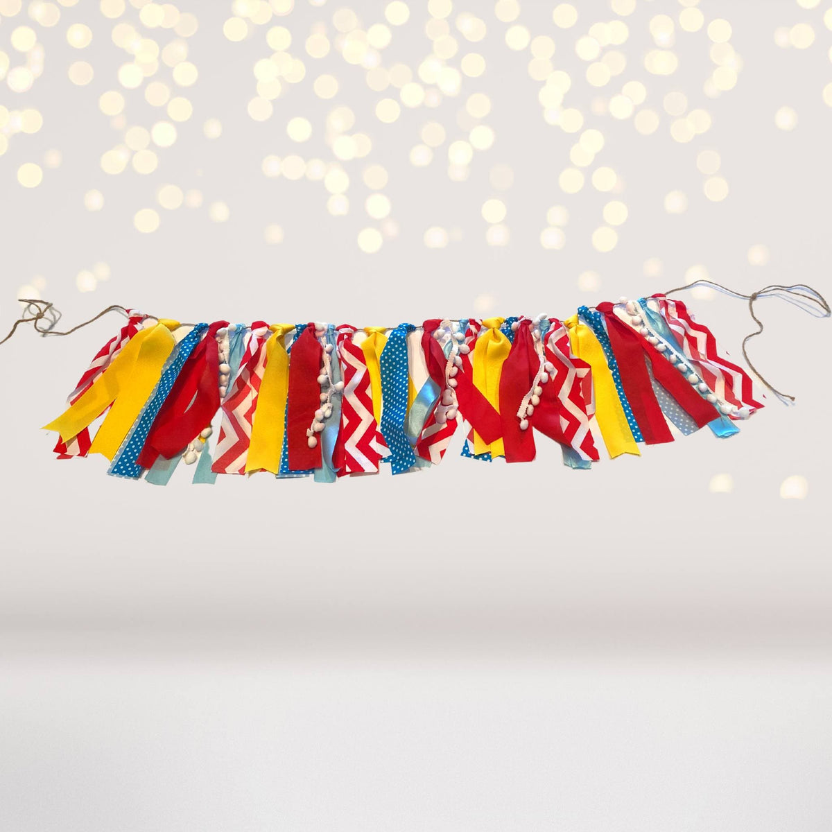Circus themed ribbon banner garland with multicolor fabric ribbons for carnival party decor on Tampa Home & Garden Store