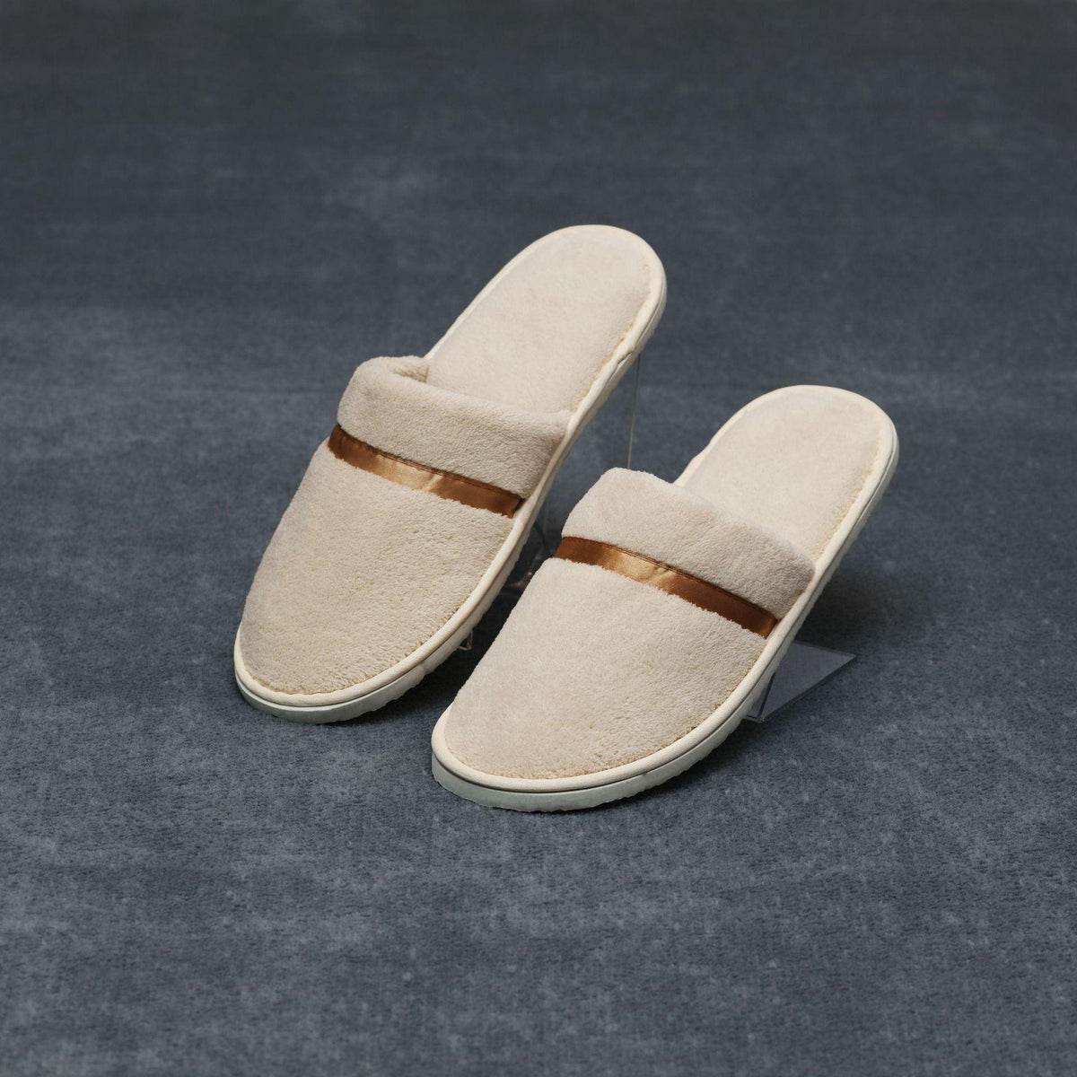 Beige plush slip-on women's slippers with brown strap non-slip sole on Tampa Home & Garden Store