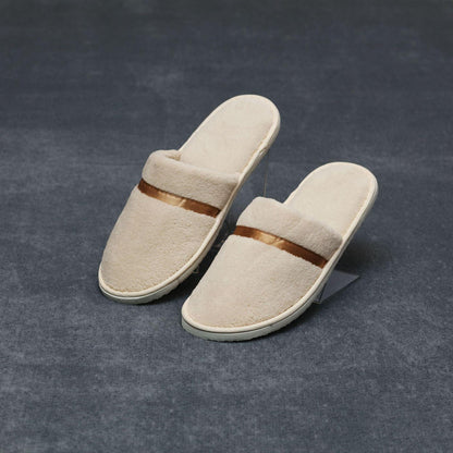 Beige plush slip-on women's slippers with brown strap non-slip sole on Tampa Home & Garden Store