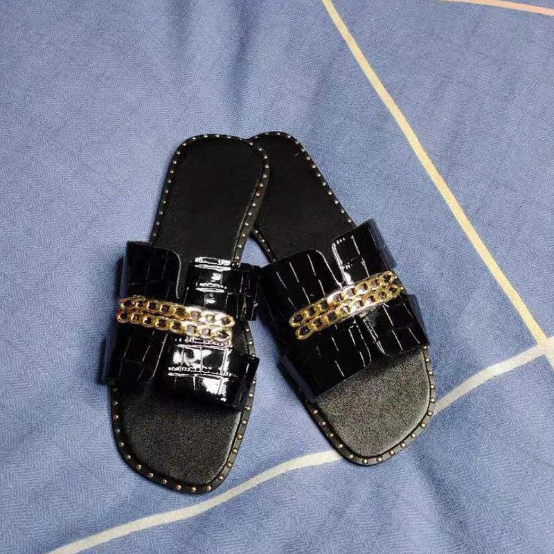 Stevvex black patent sandals with crocodile-text straps and gold chain accents, beach slides on Tampa Home & Garden Store