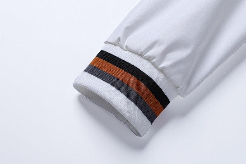 Windbreaker cuff with black, orange and gray striped rib trim on white Stevvex jacket on Tampa Home & Garden Store