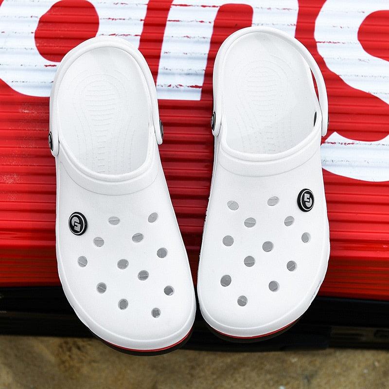 Pair of white Stevvex slip-on clogs with vent holes on Tampa Home & Garden Store