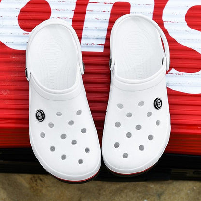 Pair of white Stevvex slip-on clogs with vent holes on Tampa Home & Garden Store