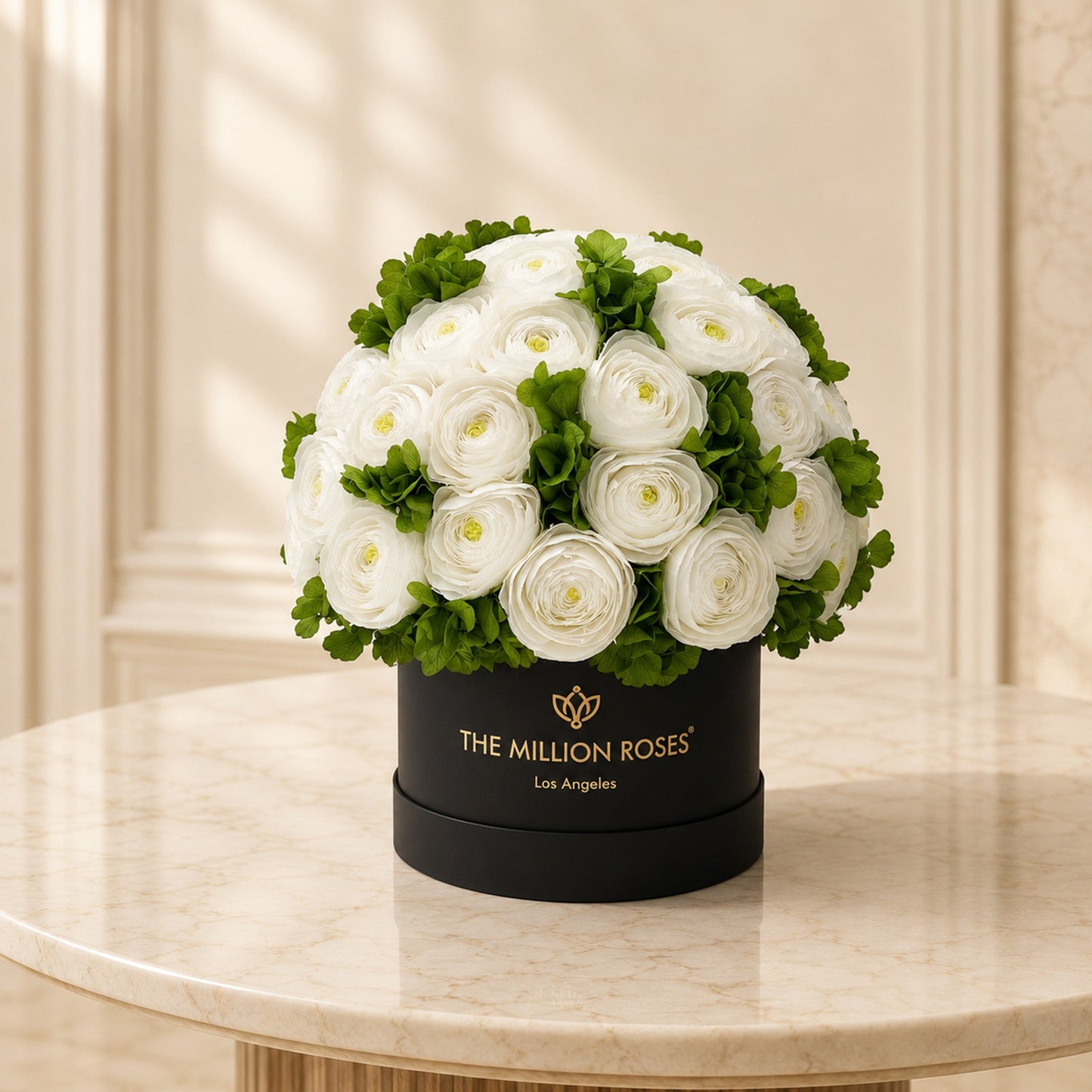 White Persian buttercups with green hydrangeas in a black The Million Roses hat box on Tampa Home & Garden Store