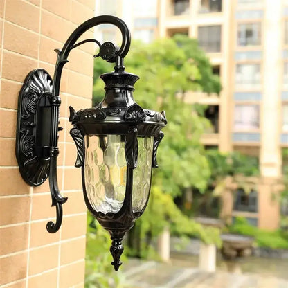 Bronze outdoor wall lamp by Decorbites with textured glass panels in classic lantern style on Tampa Home & Garden Store