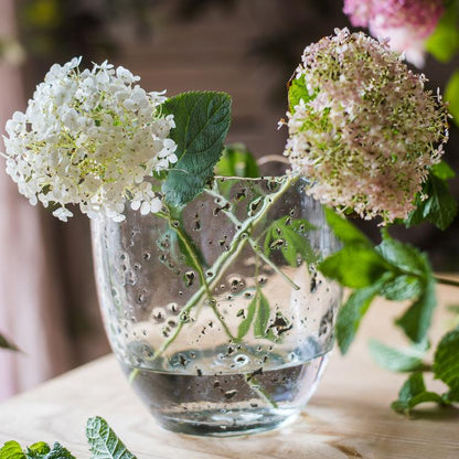 Clear art glass vase by RusticReach with two hydrangea blooms and water, air-bubble glass texture on Tampa Home & Garden Store