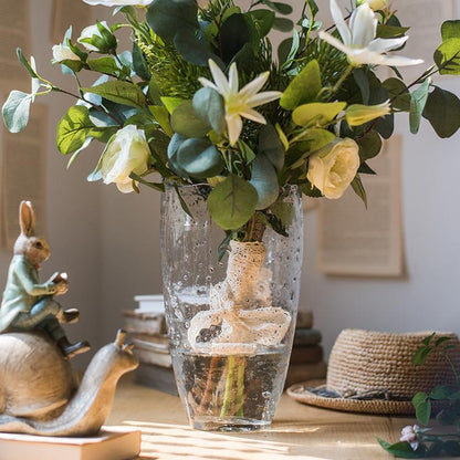 Clear Art Glass Vase by RusticReach holding a water-filled bouquet of greenery and white blooms on Tampa Home & Garden Store