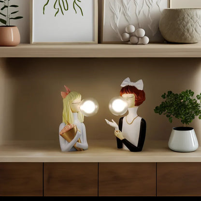 Parisian Bubble Girls Moktan Sabai clear glass LED table lamps pair with ceramic figurines on Tampa Home & Garden Store