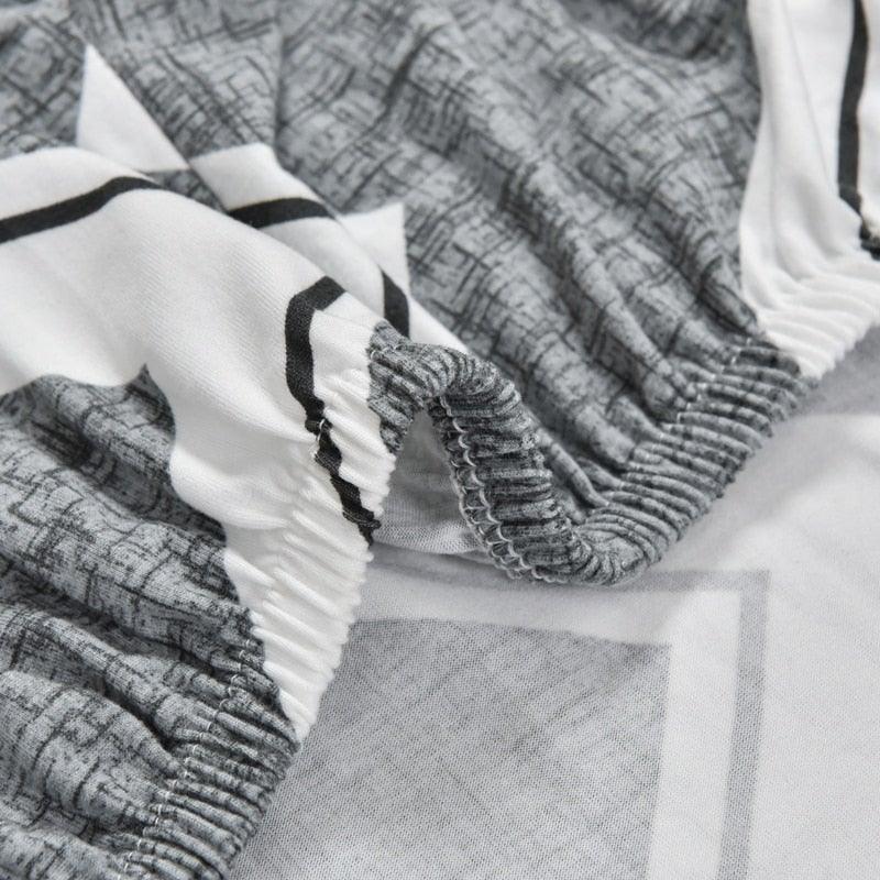 Club chair slipcover Stevvex in geometric grey print with elastic edge on Tampa Home & Garden Store