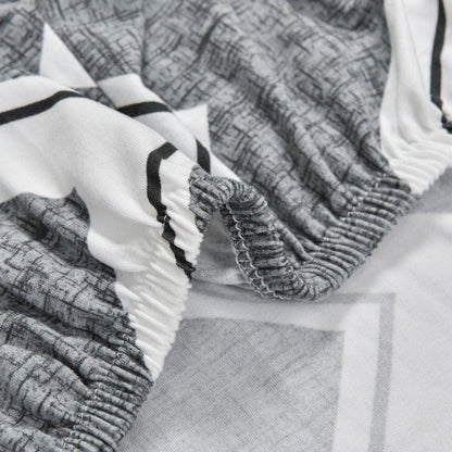 Club chair slipcover Stevvex in geometric grey print with elastic edge on Tampa Home & Garden Store