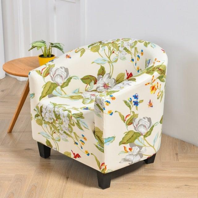 Club chair slipcover in floral cream fabric with green leaves and blooms; Stevvex elastic cover on Tampa Home & Garden Store