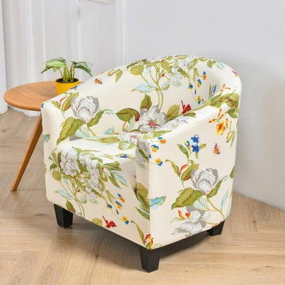 Club chair slipcover in floral cream fabric with green leaves and blooms; Stevvex elastic cover on Tampa Home & Garden Store