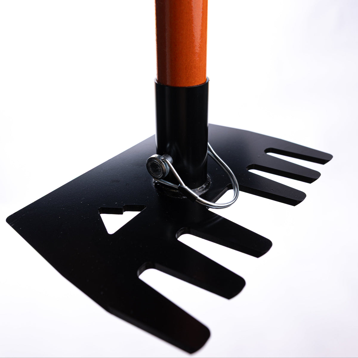 Clyde Jr rake by Backslope Tools, orange handle with black base and metal tines on Tampa Home & Garden Store