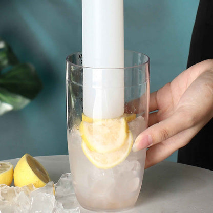 Shaketea white plastic cocktail shaker with ergonomic design used beside a glass and lemon wedges on Tampa Home & Garden Store